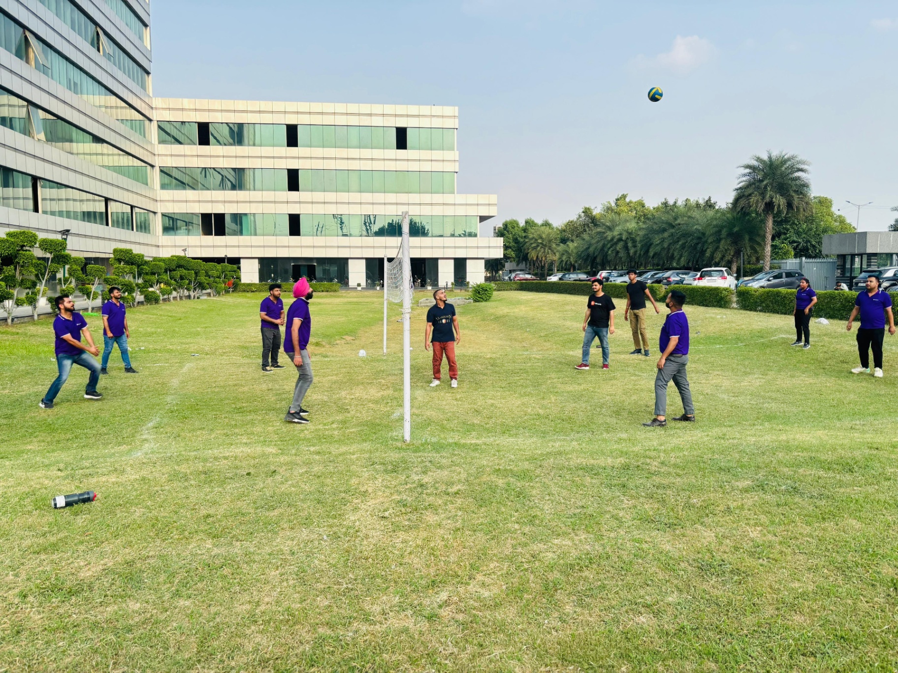 Bridgeway team playing volleyball outside the office