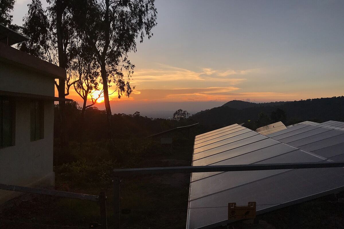 Railing-mounted balcony solar panel installation on an Indian apartment building
