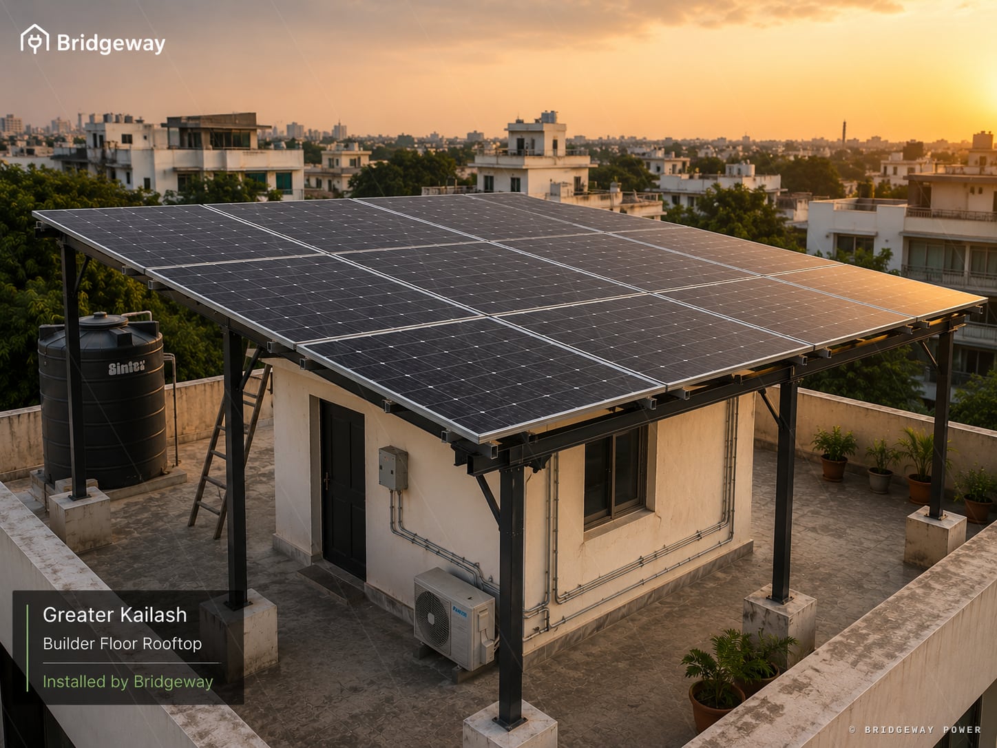 Bridgeway rooftop solar installation on a Greater Kailash builder floor in Delhi, photographed at sunset